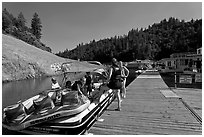 Deck with family preparing a boat, Shasta Lake. California, USA ( black and white)