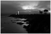 Coastal bluff with lighthouse at dusk, Point Arena. California, USA ( black and white)