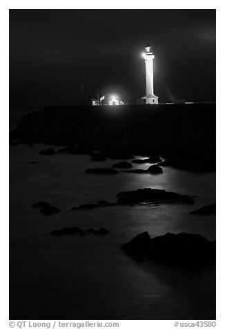 Lighthouse and reflection in surf at night, Point Arena. California, USA (black and white)