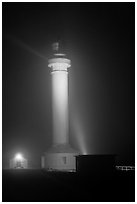 Point Arena Lighthouse on foggy night. California, USA (black and white)
