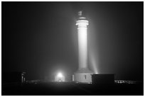 Fog and Point Arena Lighthouse by night. California, USA (black and white)