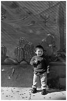 Boy and mural, Mission District. San Francisco, California, USA ( black and white)