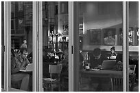 Cafe seen through windows, Mission District. San Francisco, California, USA ( black and white)