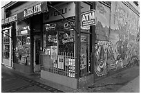 Corner store and mural, Mission District. San Francisco, California, USA ( black and white)
