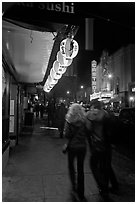 Couple on Castro street at night. San Francisco, California, USA ( black and white)