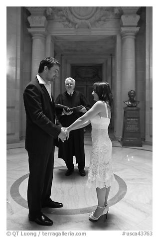 Bride, groom, and wedding officant, City Hall. San Francisco, California, USA (black and white)