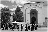Graduates walking single file into Memorial auditorium. Stanford University, California, USA ( black and white)