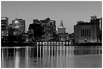 Downtown skyline accross Lake Merritt at dusk. Oakland, California, USA ( black and white)