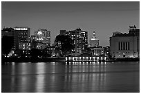 Oakland skyline reflected in Lake Merritt at night. Oakland, California, USA ( black and white)