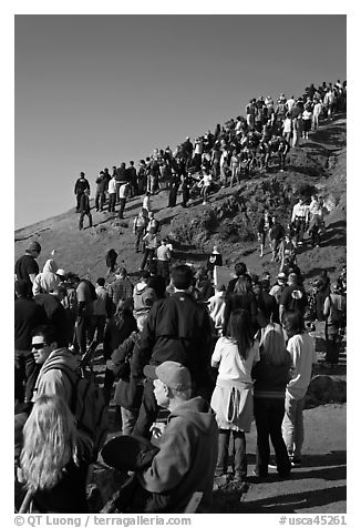 Spectators on bluff during mavericks contest. Half Moon Bay, California, USA (black and white)