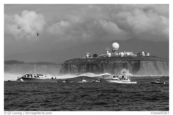 Flottila of boats near Mavericks break in front of Pillar Point radar station. Half Moon Bay, California, USA (black and white)