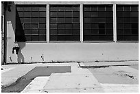 Industrial building and painted sidewalk. Berkeley, California, USA ( black and white)