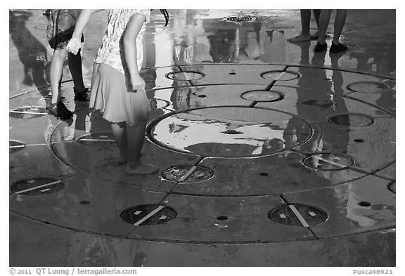 Reflections of children playing in fountain, Gilroy Gardens. California, USA (black and white)