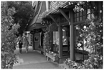 Sidewalk and stores on Ocean Avenue. Carmel-by-the-Sea, California, USA ( black and white)
