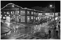 Monterey Canning company building and streets at night. Monterey, California, USA ( black and white)