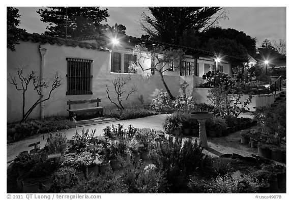 Garden and historic adobe house at night. Monterey, California, USA (black and white)