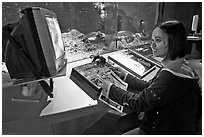 Woman controls robot, Tech Museum. San Jose, California, USA (black and white)