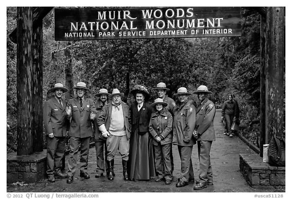 Rangers posing with Theodore Roosevelt under entrance gate. Muir Woods National Monument, California, USA