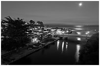 Capitola village, Soquel Creek and moon. Capitola, California, USA ( black and white)