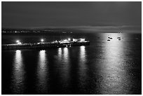 Pier and yachts with moon reflection. Capitola, California, USA (black and white)