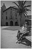 Students with laptop on bench. Stanford University, California, USA ( black and white)