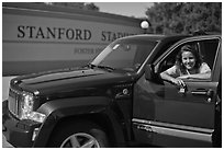 Student with new car. Stanford University, California, USA ( black and white)