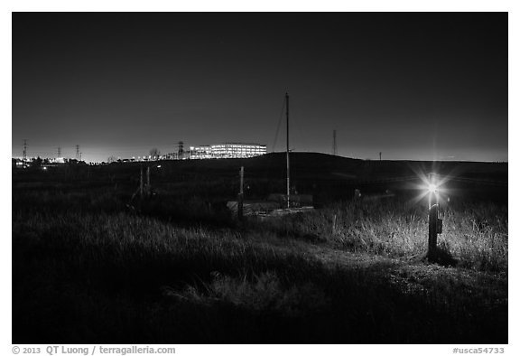 Marsh by night with office building in distance, Alviso. San Jose, California, USA