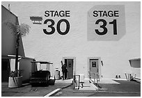 Man entering soundstage, Paramount Pictures Studios lot. Hollywood, Los Angeles, California, USA (black and white)