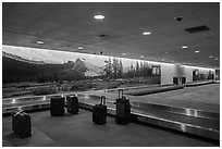 Baggage claim area and Yosemite murals, Fresno Yosemite Airport. California, USA ( black and white)