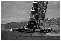 Emirates Team New Zealand Aotearoa catamaran foiling in upwind leg. San Francisco, California, USA ( black and white)