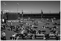 Synthetic lawn and giant screen, America's Cup Park. San Francisco, California, USA ( black and white)