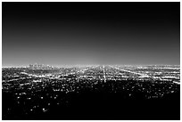 Lights of street grid and downtown at night from Griffith Park. Los Angeles, California, USA ( black and white)