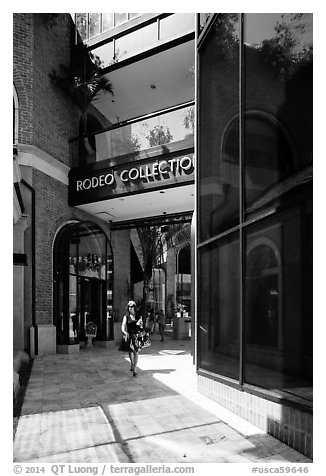Woman walks in Rodeo Collection shopping area. Beverly Hills, Los Angeles, California, USA (black and white)