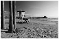 Lifeguard tower, empty beach, and Newport Pier. Newport Beach, Orange County, California, USA ( black and white)