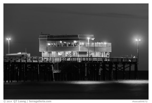 Newport Pier and restaurant at night. Newport Beach, Orange County, California, USA (black and white)