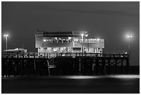 Newport Pier and restaurant at night. Newport Beach, Orange County, California, USA ( black and white)
