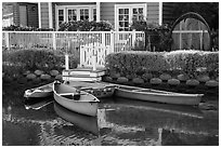 Rowboats in front of house, Venice Canal Historic District. Venice, Los Angeles, California, USA ( black and white)