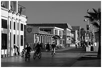 Riding bicycles on beachfront promenade, Hermosa Beach. Los Angeles, California, USA ( black and white)