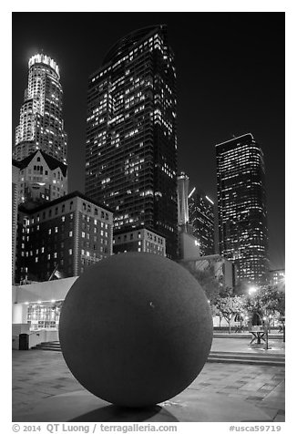 Spherical sculpture and skyscrappers at night, Pershing Square. Los Angeles, California, USA (black and white)