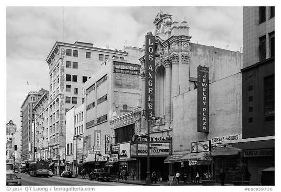 Downtown street with Los Angeles historic theater. Los Angeles, California, USA (black and white)