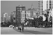 People exercising on beach promenade. Long Beach, Los Angeles, California, USA ( black and white)