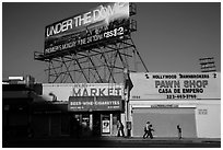 Street with liquor and pawn shops. Hollywood, Los Angeles, California, USA ( black and white)