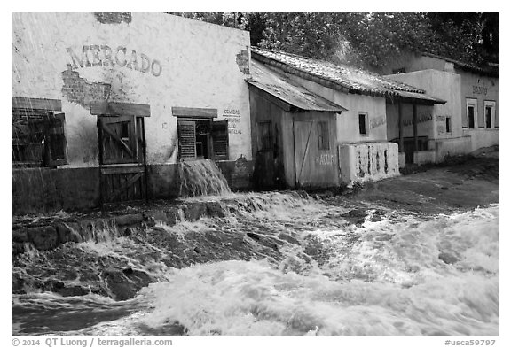 Adobe buildings and artificial flood, Universal Studios. Universal City, Los Angeles, California, USA (black and white)