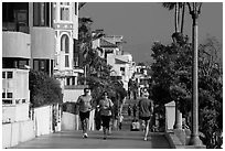People exercising, beachfront promenade, Manhattan Beach. Los Angeles, California, USA ( black and white)
