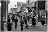 People stroll on Ocean Front Walk. Venice, Los Angeles, California, USA ( black and white)
