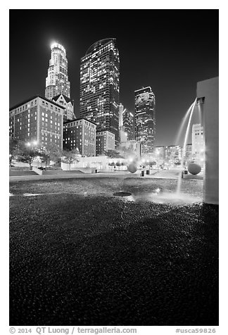 Fountain and high-rises at night, Pershing Square. Los Angeles, California, USA (black and white)