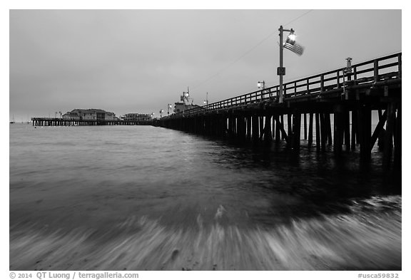 Pier and wave at dawn. Santa Barbara, California, USA (black and white)