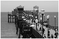 Lamps and pier, Oceanside. California, USA ( black and white)