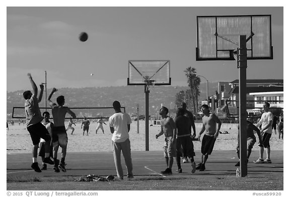 Men playing basketball, Mission Beach. San Diego, California, USA (black and white)