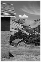 Barracks and hills, Fort Tejon state historic park. California, USA ( black and white)